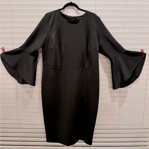 New With Tags! Stunning Scuba dress from Elloqui in black with flare sleeves!